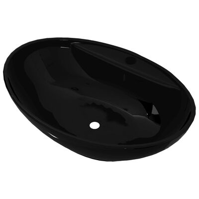 Čierne oválne keramické umývadlo do kúpeľne s otvorom na batériu
