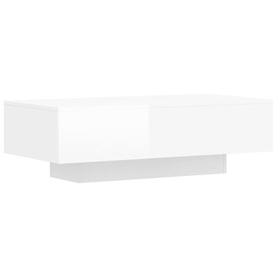 vidaXL Konferenčný stolík lesklý biely 100x49,5x31 cm kompozitné drevo