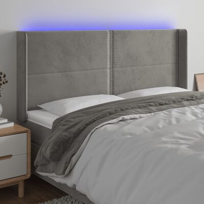 vidaXL Čelo postele s LED bledosivé 163x16x118/128 cm zamat