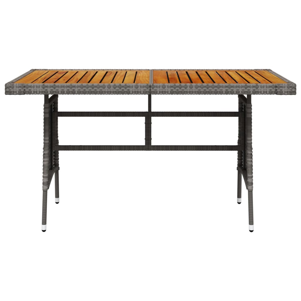 vidaXL Záhradný stôl sivý 130x70x72 cm polyratan a akáciový masív