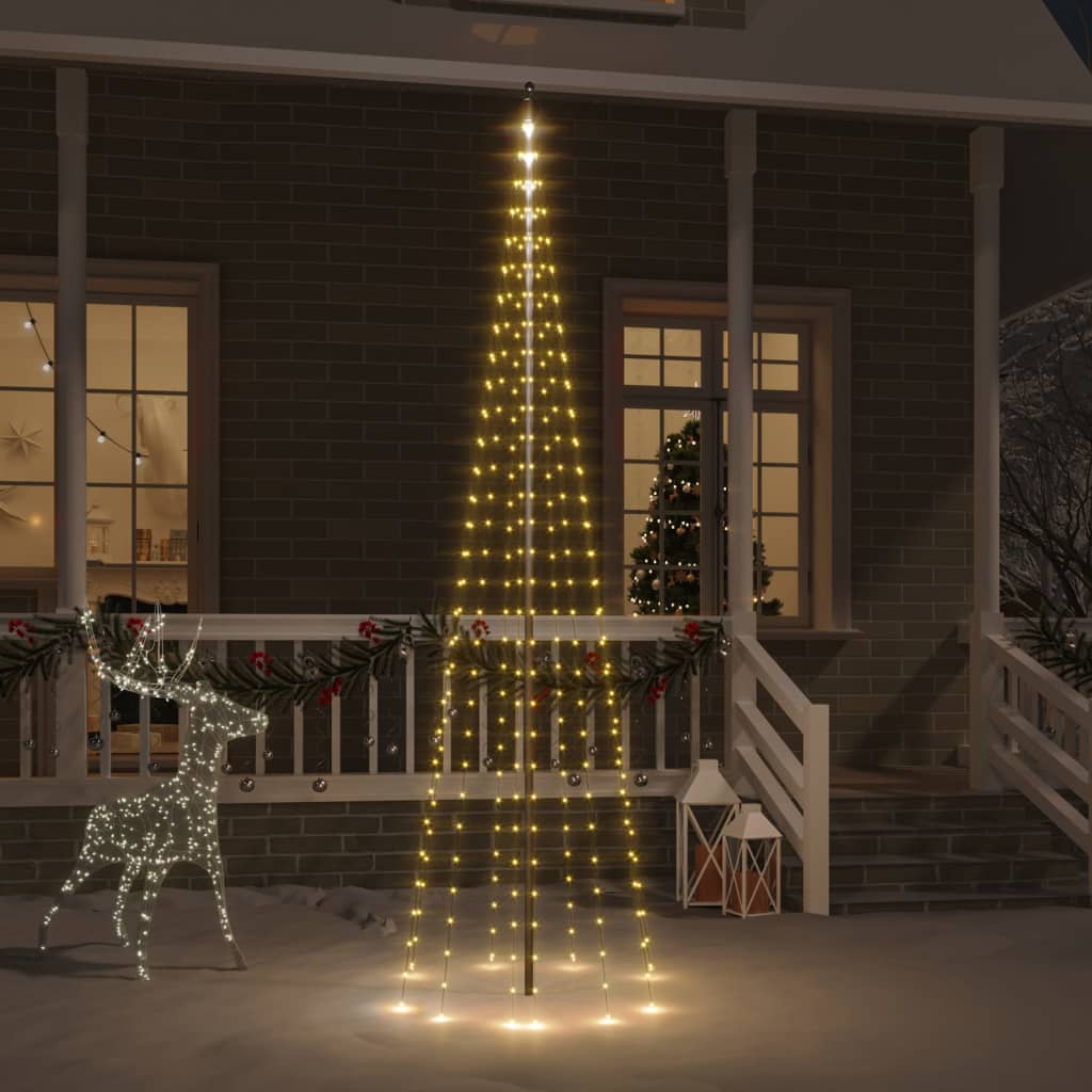 vidaXL Vianočný stromček na stožiari teplé biele svetlo 310 LED 300 cm