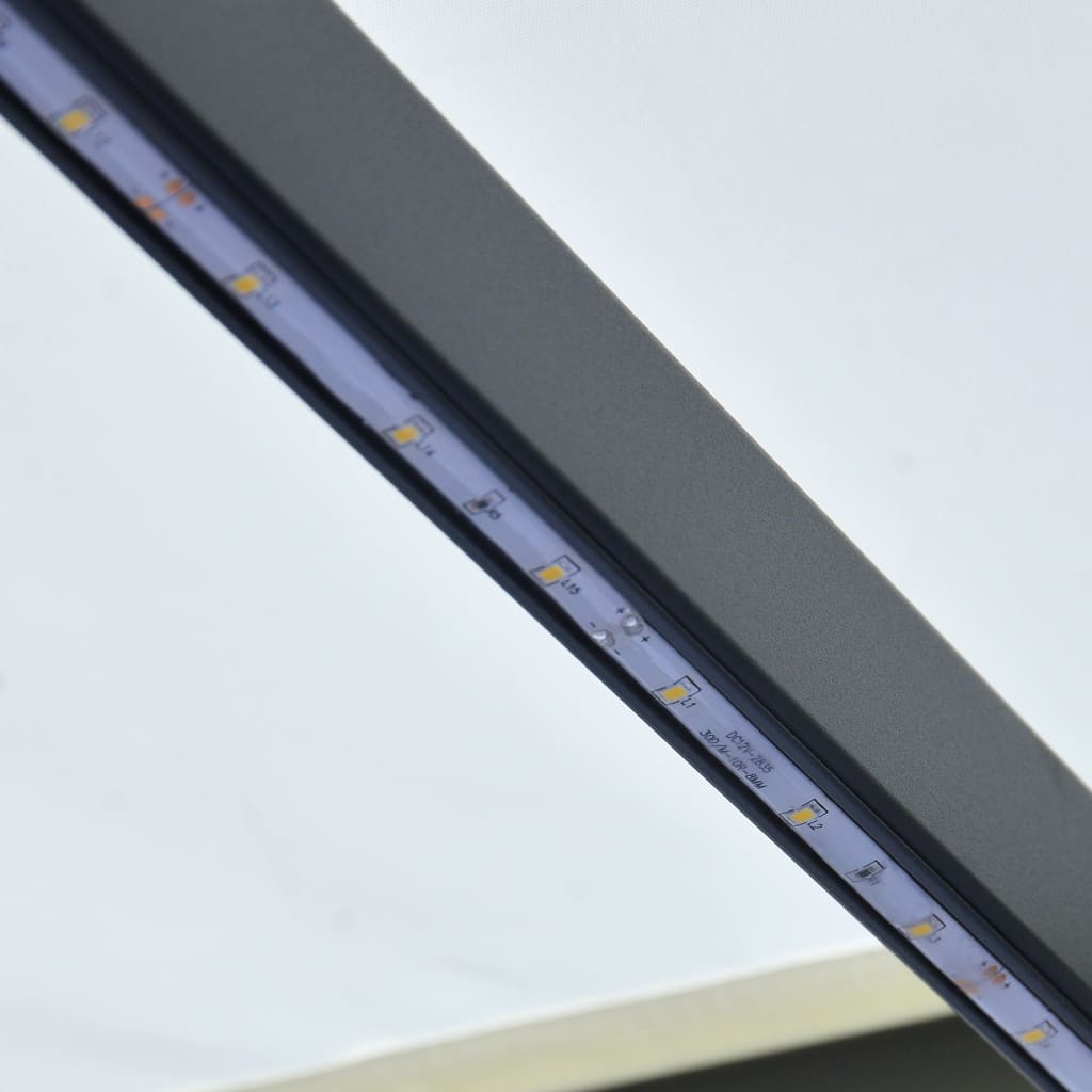 vidaXL Ručne zaťahovacia markíza s LED 600x300 cm krémová